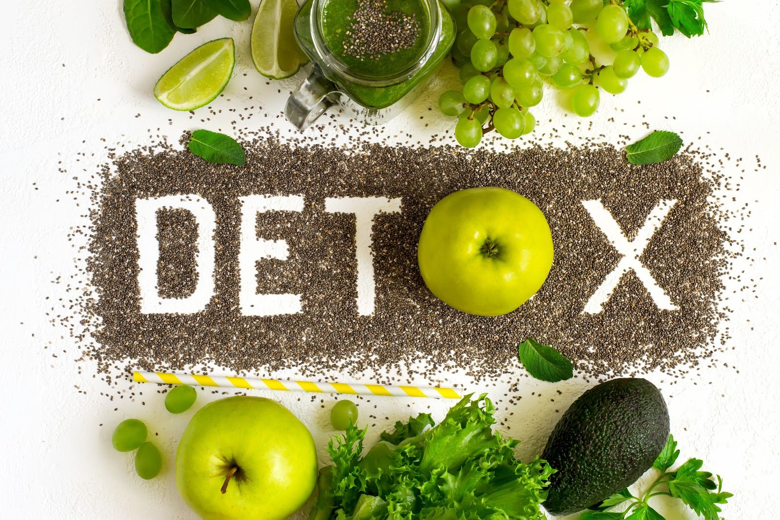 The word DETOX spelled out in chia seeds and surrounded by green apples, leafy greens and smoothie ingredients — the clinical detoxification principles Nutrition 205 separates from marketing myth for chiropractors