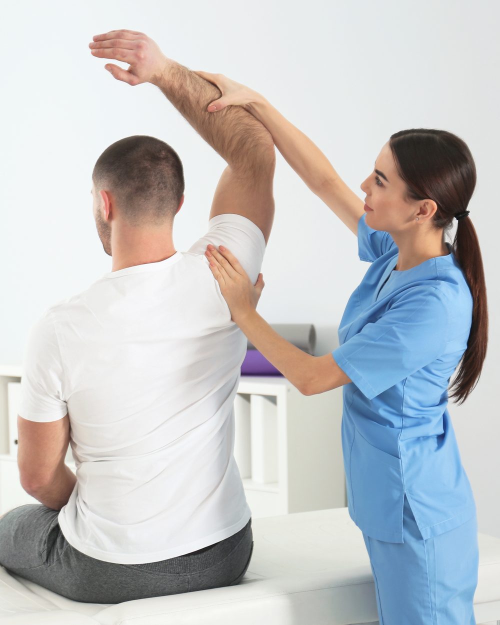 Chiropractor performing shoulder assessment and manual therapy — adjusting and manual therapy CE courses; CCEDseminars category page