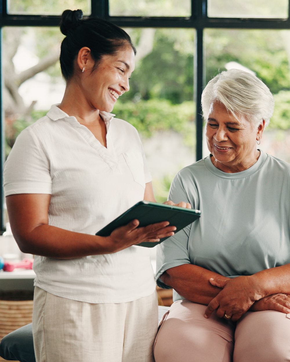 Chiropractic assistant guiding a patient in a clinical setting — Certified Chiropractic Clinical Assistant (CCCA) online certification program; CCEDseminars