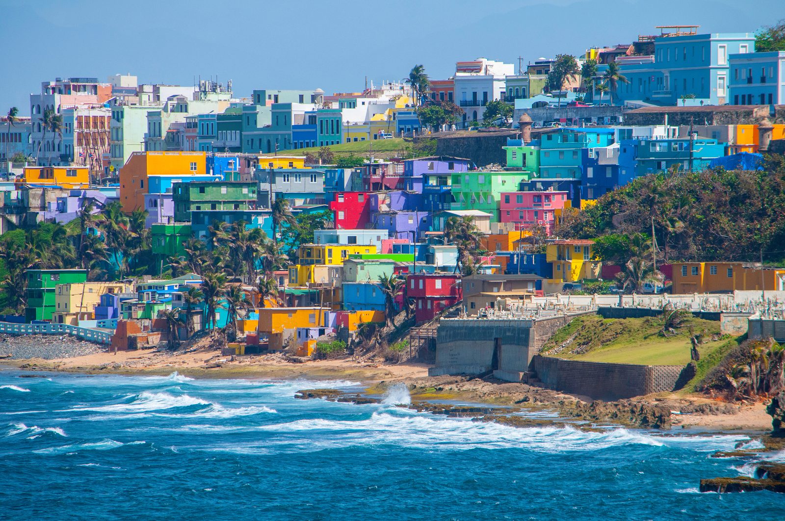 Colorful hillside houses along the Old San Juan coastline, Puerto Rico — Puerto Rico chiropractic CE requirements guide
