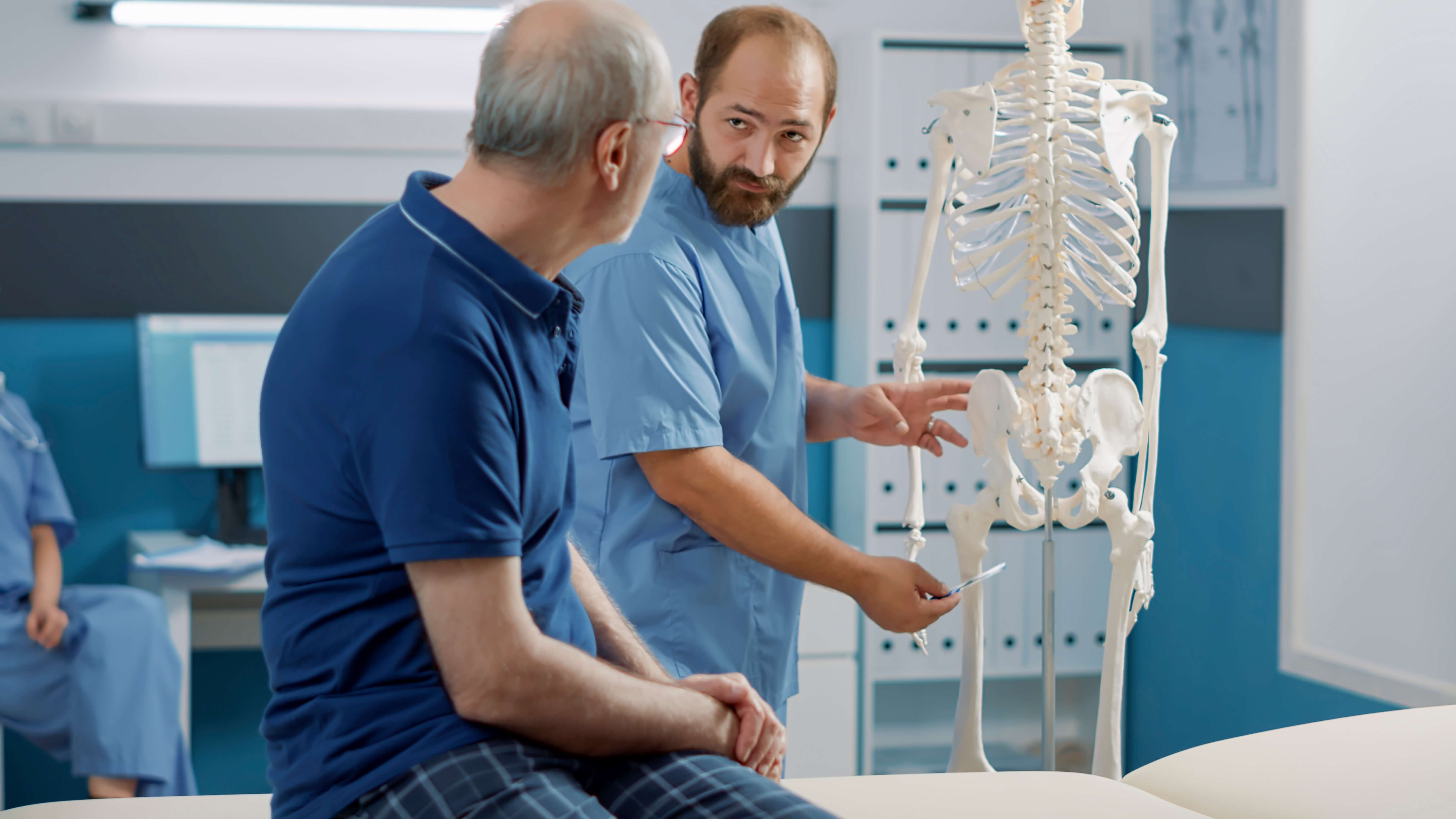 Image of chiropractor explaining condition to patient
