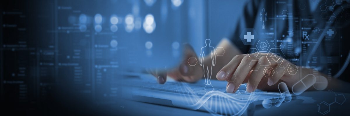 Chiropractor typing patient records into a secure EHR for online documentation and risk management CE webinar.