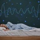 Woman asleep on her side in star-print pajamas beneath a starry wall with glowing brain-wave lines — Sleep and Longevity live chiropractic CE webinar with Dr. Michael Hall, December 10, 2026